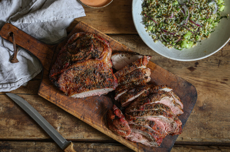 Butterflied and marinated leg of lamb with a parsley and couscous salad and harissa