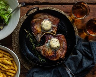 Ask yourself this. When did you last have a really good pork chop?

This is why we keep coming back to it. Native, rare breed pork. Dry aged on the bone. Proper depth of flavour. Nothing like the pale, wet stuff you see elsewhere.

These are our Pork Chops with Rosemary and Anchovy Butter. Two thick, rindless chops. Two discs of handmade compound butter. Anchovy, rosemary, lemon zest, a little shallot. Old friends. It works.