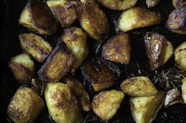 Close-up of golden, crunchy duck fat roast potatoes.