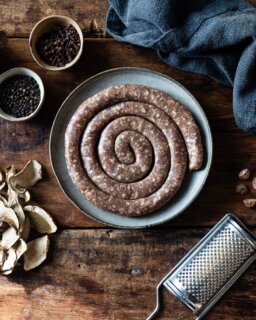 Look at this fine looking sausage. This is the fourth autumn we have made Luganega in collaboration with @jacobkenedy Kenedy of @bocca_di_lupo , and it has become one of the small rituals of our year.

We make it with shoulder and belly from our native breed pigs, seasoned with dried porcini, black pepper, nutmeg, cinnamon and a little clove, before coiling it into its spiral. The spice is gentle and the porcini gives it a deep, earthy savour that suits the turn of the season.

In Soho, Jacob serves it with farro, roasted porcini and tarragon. We tend to cook ours more plainly, in a hot pan with polenta or lentils and some bitter leaves on the side, which is no worse for it.