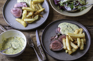 bernaise sauce in a bowl and served with steak and chips