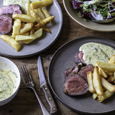 bernaise sauce in a bowl and served with steak and chips