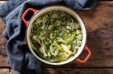 Vignarola, a spring vegetable stew inside a casserole dish.