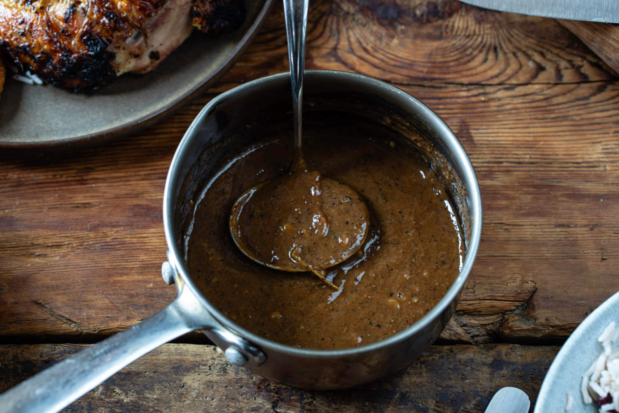 Melissa Thompson's jerk chicken gravy made in a saucepan.