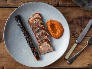 Pork Tenderloin with Romesco Sauce & Blackened Leeks