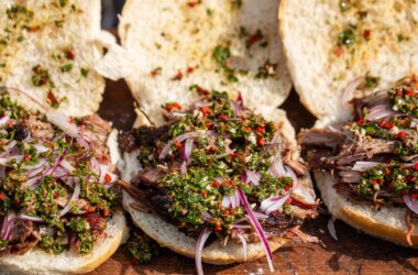 Smoked hogget shoulder piled into soft buns, topped with vibrant green chimichurri sauce