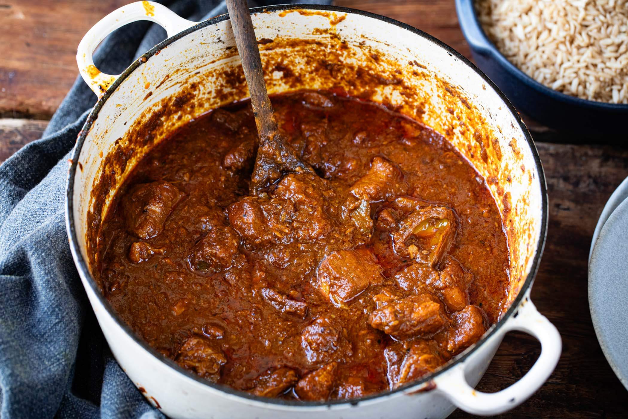 Rich Burmese pork and mango pickle curry cooked in a casserole dish, a vibrant and flavourful family recipe from The Rangoon Sisters