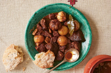 Traditional Ohrid-style beef stew with shallots and garlic, slow-cooked until tender and served in an earthenware pot