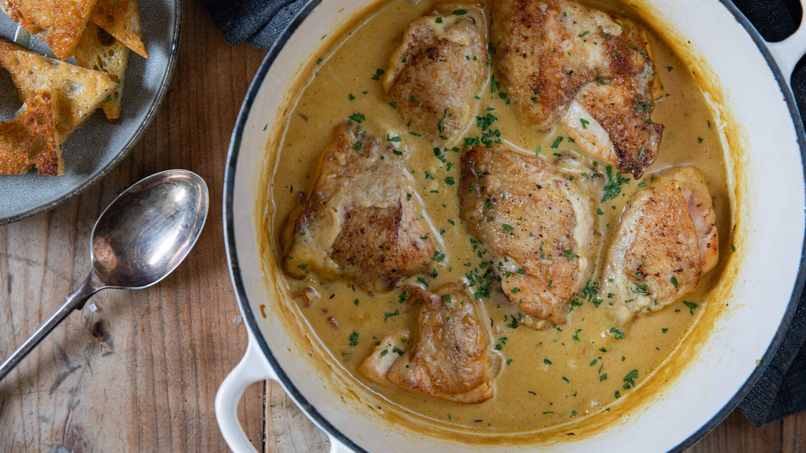 A cast iron pot with Valentine Warner's chicken with Dijon mustard sauce within
